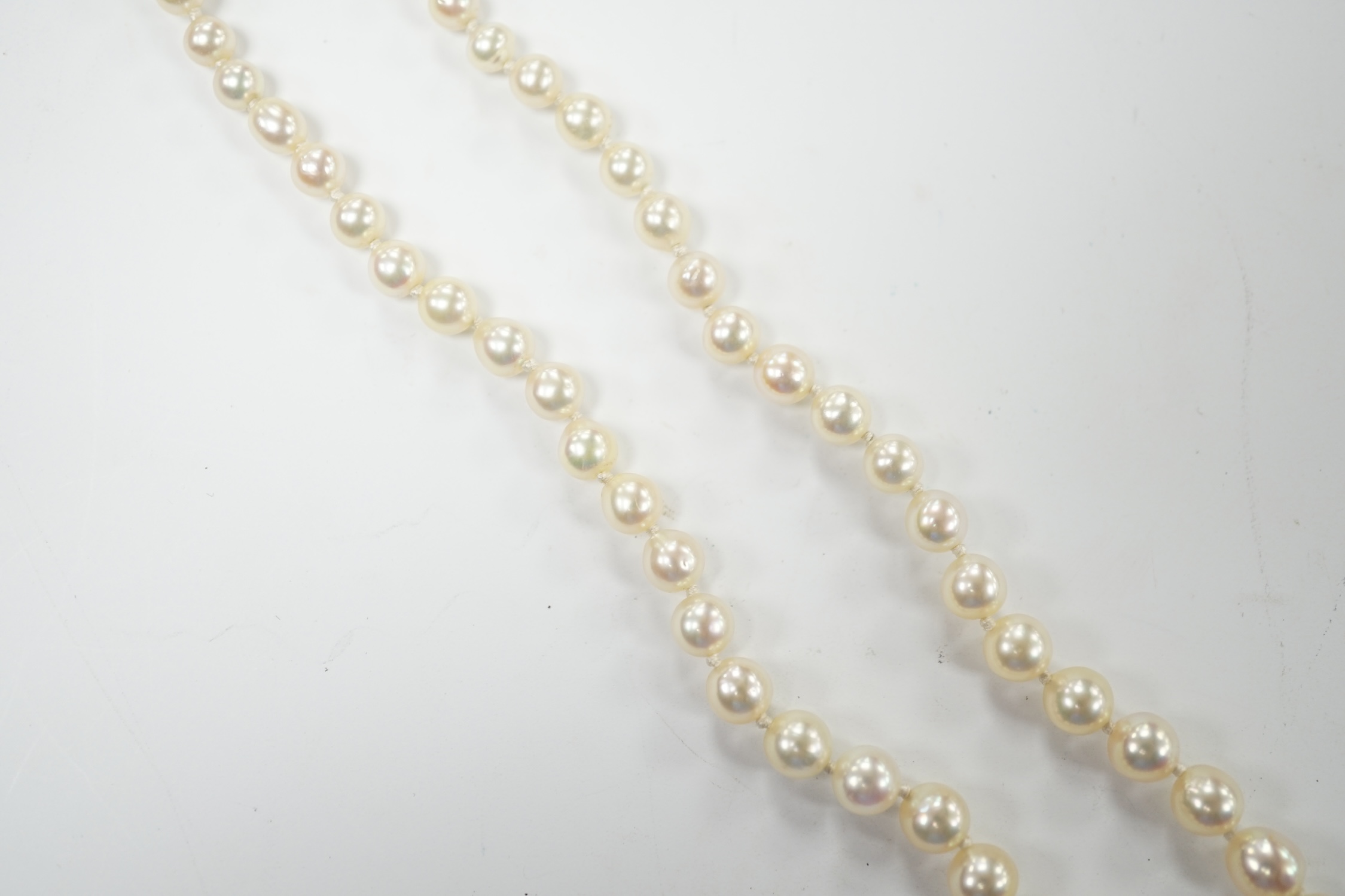A single strand graduated cultured pearl necklace, with diamond set white metal clasp, 48cm. Good condition.
